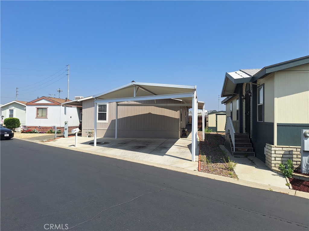 WELCOME TO RIALTO !!!!!TIMBER CANYON MOBILE HOME PARK!!!!! AMAZING OPPORTUNITY IS KNOCKING YOUR DOOR, COME AND SEE THIS BEAUTIFUL AND WELL MAINTAINED 3 BEDROOM 2 BATHROOM WITH WRAP AROUND STEEL PATIO COVER LOW MAINTENCE YARD LEAVING PLENTY OF SPACE TO RELAX, MANUFACTURE HOME WITH LAUNDRY ROOM INSIDE, PANTRY AND OPEN CONCEPT KITCHEN AND LIVING ROOM. EXTRA STORAGE BOX ON THE BACK THAT WILL STAY WITH THE MOBIL HOME
