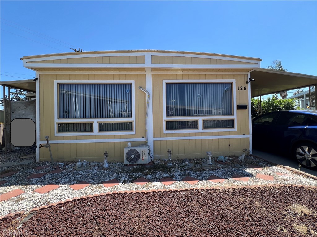 The Beautiful 2 bedrooms and 2 bath property nestled in the “Kings Way Gardens” Mobile Home Park, located in La Verne, the city with highly rated schools. It features spacious living room & family room surrounded with mountain hills view, newer individual A/C unit installed in additional to the central A/C, formal dining room and additional den area with laminated flooring throughout. Leading to the outdoors with Large enclosed patio space leading to a nice backyard with easy maintenance artificial turf, perfect for relaxation. It offers larger front yard with huge carport to fit 3 cars and newer fencing/gate. The community with amenities including swimming pool and spa, clubhouses, playground, dog park and etc. There’s also a community pool and no HOA fees. The new Metro A Line (light rail) extension connects La Verne directly to Azusa, Pomona, and beyond—making commutes and trips into Pasadena and Downtown Los Angeles more accessible than ever.