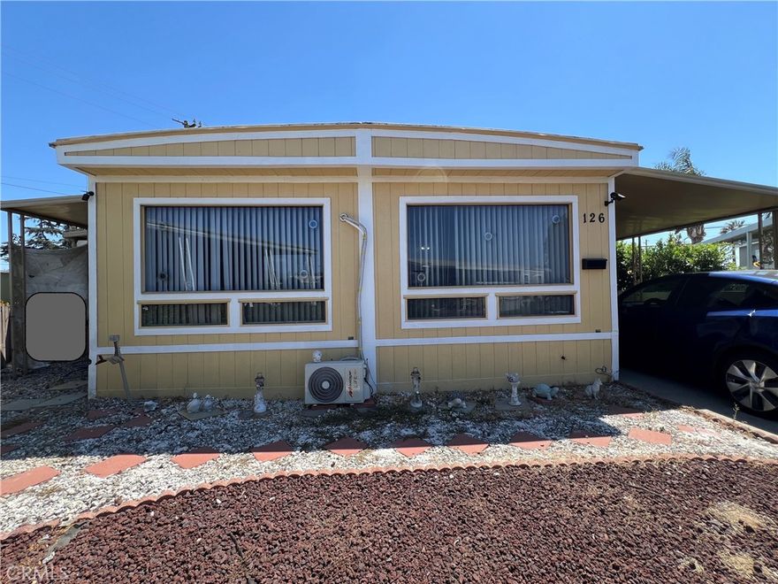The Beautiful 2 bedrooms and 2 bath property nestled in the “Kings Way Gardens” Mobile Home Park, located in La Verne, the city with highly rated schools.  It features spacious living room & family room surrounded with mountain hills view, newer individual A/C unit installed in additional to the central A/C, formal dining room and additional den area with laminated flooring throughout. Leading to the outdoors with Large enclosed patio space leading to a nice backyard with easy maintenance artificial turf, perfect for relaxation. It offers larger front yard with huge carport to fit 3 cars and newer fencing/gate. The community with amenities including swimming pool and spa, clubhouses, playground, dog park and etc. There’s also a community pool and no HOA fees. The new Metro A Line (light rail) extension connects La Verne directly to Azusa, Pomona, and beyond—making commutes and trips into Pasadena and Downtown Los Angeles more accessible than ever.