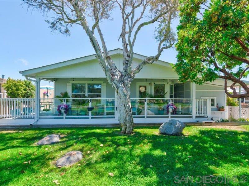 OPEN HOUSE THIS SATURDAY, AUG 2, 2025 11am-2pm. Immaculate Lakeside Home in Coveted 55+ Lakeshore Gardens! Own Carlsbad lakefront living—with yard, decks, and thoughtful upgrades—for under $500K! This beautifully maintained 2-bedroom + office home offers tall ceilings, upgraded flooring, a gourmet Viking range/oven, and an open kitchen with breakfast bar—perfect for entertaining or daily living. Enjoy indoor-outdoor living with a wraparound-style deck, including a covered lakeside area where you can relax with views of greenbelts, fountains, ducks, turtles, herons, egrets, brilliant sunsets, and gentle lake breezes. One of the rare lakefront homes with a gated turf side yard —ideal for pets or garden space. The spacious primary suite features an oversized bathroom, generous storage, and excellent natural light. Additional highlights include a custom pantry in the laundry room, upgraded lighting, newer ceiling fans throughout, a large storage shed, direct greenbelt access, and a quiet indoor environment. Lakefront homes with this blend of upgrades, privacy, and outdoor space are rare—making this one of the most compelling values in the community. Lakeshore Gardens spans 54 beautifully landscaped acres with 10 freshwater lakes and offers resort-style amenities: pool, spa, clubhouse, fitness center, library, firepit patio, and more. Just blocks from the beach, I-5, Coaster, and shopping—golf cart–friendly too! Monthly space rent: $2,825 – Even with space rent, owning here beats the cost of nearby rentals! Lakeshore Gardens is a luxury, active 55+ manufactured home community located in Carlsbad—just steps from the beach. Spanning 54 beautifully landscaped acres, the community features 383 homesites and 10 peaceful lakes surrounded by lush greenbelts, mature trees, and vibrant wildlife. The park-like setting is home to egrets, gray herons, ducks, cormorants, turtles, and fish—making it a paradise for nature lovers. The approximately 14,000 sq. ft., two-story clubhouse has been tastefully updated to reflect a high-end country club feel. The upper level includes the management offices, welcoming lobby, a card room with fireplace, billiard room, and an ocean-view balcony. Downstairs, residents enjoy a well-stocked library, a recreation room with stage, commercial-grade kitchen and restrooms. A large community patio with fountain, fire pit, and outdoor fireplace adjoins the event space, while the year-round heated pool and spa are perfect for relaxing. Additional amenities include saunas, fitness center, ping pong , RV parking, and a secure laundry building. The entire community is enclosed by a 6-foot wall with security gates and a telephone entry system for peace of mind. Residents enjoy a wide variety of activities nearly every day, including card games, bingo, craft groups, potlucks, monthly breakfasts, ladies’ luncheons, men's groups, golf groups, off site activities and more. Whether you're looking for relaxation, community, or both—you'll find it all at Lakeshore Gardens.