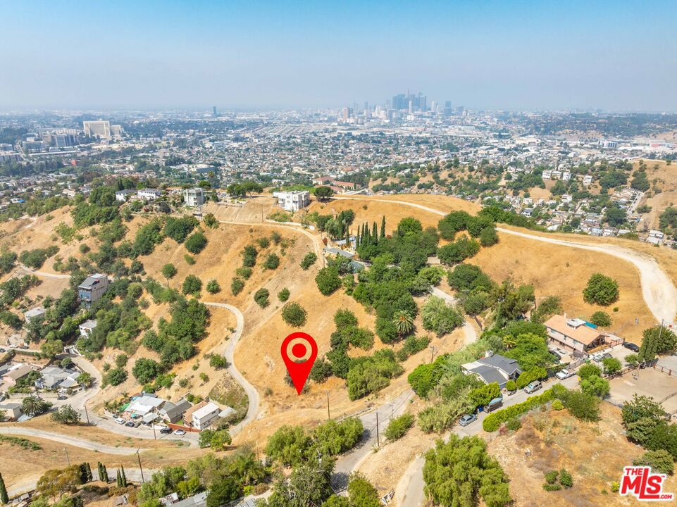 Welcome to 2661 N Forest Park Dr, an incredible opportunity to build in the scenic hills of El Sereno. This expansive 8,790-square-foot upslope lot offers panoramic views of the city skyline and surrounding canyon, making it the perfect setting for a modern hillside residence or investment project. Tucked away on a peaceful residential street, the lot provides a sense of privacy and elevation while still being just minutes from all that Northeast LA has to offer. Nearby attractions include Ascot Hills Park, El Sereno Recreation Center, and local favorites like Holy Grounds Coffee, Cha Cha Chili, and Matt's Coffee Express. The location also offers easy access to major freeways, making commuting to Downtown LA, Pasadena, and the SGV a breeze. Whether you're a developer, investor, or future homeowner, this lot delivers stunning views, a great location, and an exceptional canvas to bring your vision to life in one of LA's most promising neighborhoods.