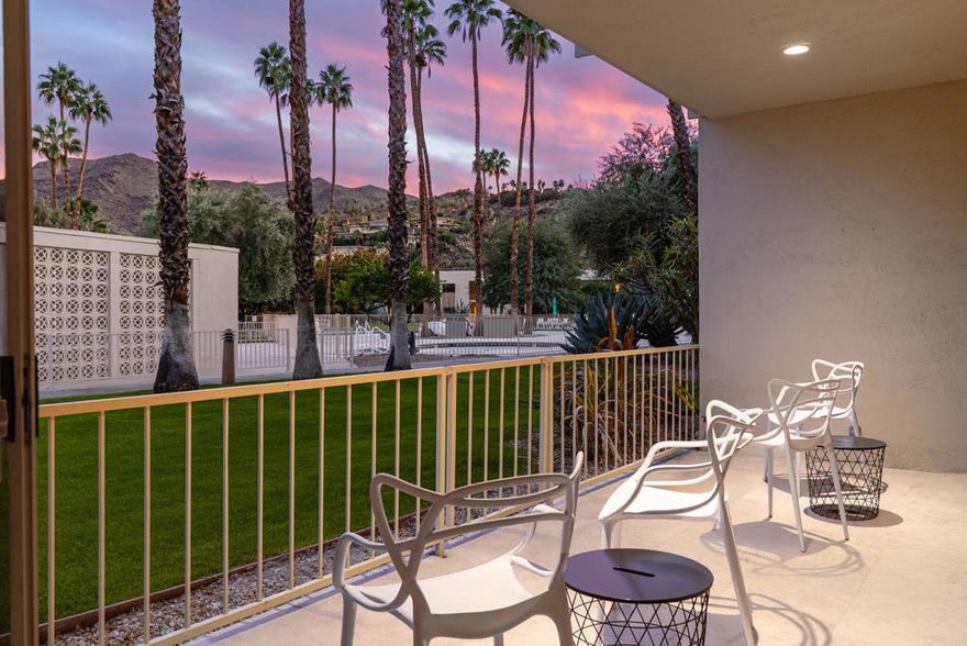 Ease into resort living in this spacious late-century modern one bedroom + den, two bath condominium, designed by renowned architect Richard Harrison.  Located within the much desired Seven Lakes Golf & Country Club, this south facing unit offers views of iconic Southridge from its leisure terrace. Inside, the expansive floor plan showcases clean lines, travertine tile flooring throughout, abundant natural light and versatile living and dining spaces. A custom Murphy bed finished in beautiful wood cabinetry allows for an easy guest room. The contemporary kitchen offers ample quartz counters, gleaming stainless appliances and abundant storage.  Your generously sized primary suite is complemented by a large walk in closet, a huge bathroom with built in cabinets and a walk in shower, while the second full bathroom is tucked privately at the rear of the home. A separate den makes a perfect work from home space or Zen room. Then step outside to your private rear courtyard, ideal for entertaining, dining al fresco, or enjoying tranquil mornings surrounded by lush surroundings. A private one-car carport with additional storage, and a ChargePoint Level 2 EV charger are included for your convenience.  Other upgrades include new plumbing with a new main water line and updated HVAC. Out your door, the largest of 7 Lakes' 15 tranquil pools is just steps away. Past the 24-hour guarded gate, 'The Gem of the Desert' offers a unique elevated lifestyle with its Ted Robinson-designed 18-hole executive golf course and the lively William Cody designed clubhouse waiting to welcome you to its formal dining room, casual cocktail lounge, and a terrace overlooking the waterfall-fountain. Welcome home!