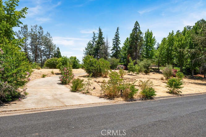 Fantastic Vacant lot in a highly desired, upscale neighborhood in Lower Paradise, Close proximity to Chico and Oroville from Lower Pentz Road. 10 Minute drive to Lake Oroville Lime Saddle Marina. Fantastic Views- Home burnt in 2018. Previous home was 3/2 2134sqft. Septic in place but needs inspection, seller is unaware of anything about septic. Water is Del Oro. Concrete Driveway still in great Condition. Only a few lots still available in this neighborhood. This lot is surrounded by Beautiful Homes. Come take a look and discover your New Dream Home Location.
Lot is trimmed/cleared and seller will provide defensible space clearance. All else- AS-IS.