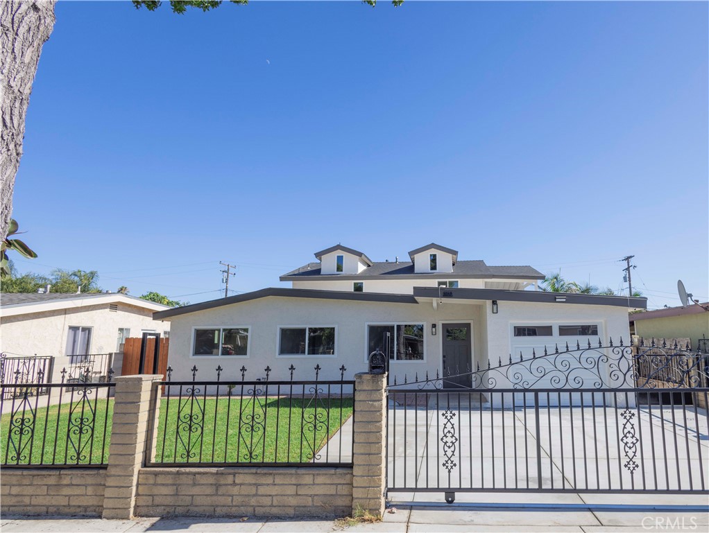 This beautifully remodeled home is perfect for a large family, offering 6 spacious bedrooms and 5 modern bathrooms. Every detail has been thoughtfully updated, including a brand-new HVAC system to ensure year-round comfort. The kitchen has been fully renovated with elegant quartz countertops, providing both style and functionality. Throughout the home, you'll find new flooring, fresh paint, updated windows and doors, creating a clean and contemporary feel. The exterior has also been refreshed with new sod in both the front and backyard. The large backyard feels like a private park—ideal for entertaining, relaxing, or letting the kids play. This move-in ready home combines space, comfort, and modern upgrades, making it a truly exceptional find.