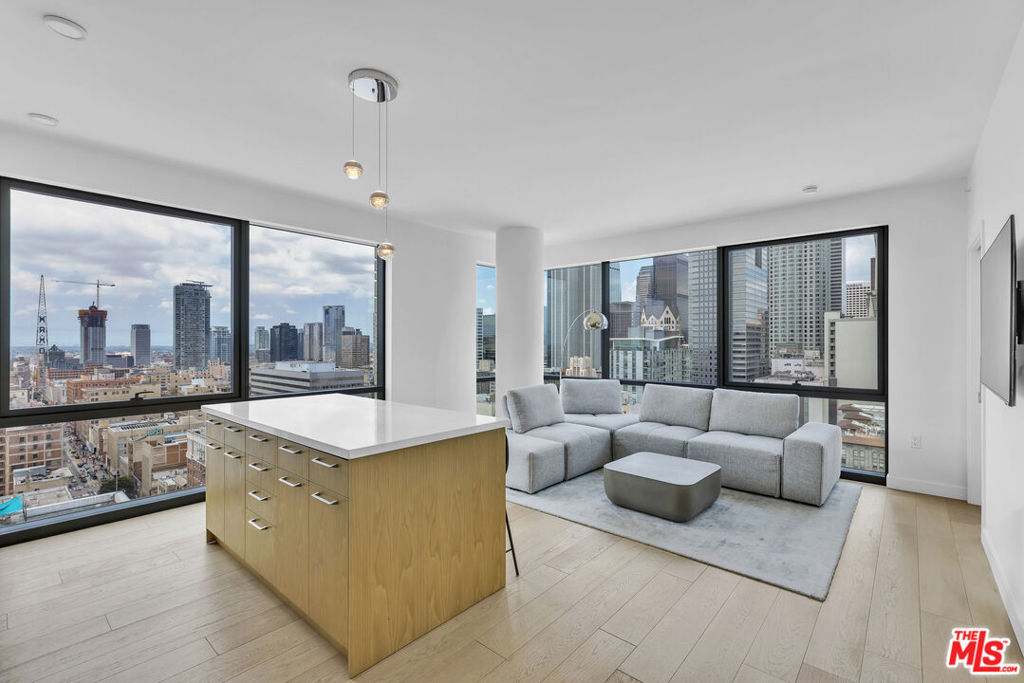 Welcome to your new home on the 24th floor of downtown LA's newest and most luxurious high-rise Perla on Broadway! This fully furnished 900 sqft unit boasts an unparalleled west-facing view of the city skyline, the most sought-after vista in the area.Inside, you'll find two spacious queen beds, two full bathrooms, a beautiful and comfortable couch, and a fully stocked kitchen, all designed for your ultimate comfort and convenience.Your rent includes all essential utilities such as water, gas, and trash, making budgeting a breeze. Additionally, a secure underground parking space is dedicated to you, ensuring your vehicle's safety.Residents of this prestigious building enjoy 24/7 security and concierge services, offering peace of mind and top-notch assistance. The amenities are second to none, featuring a heated pool, an expansive gym, study rooms, a theater, and LA's only 360-degree rooftop deck, providing stunning panoramic views of the city.This is the perfect space for someone seeking luxury living in the heart of the city. Don't miss out on the opportunity to call this incredible condo your home!