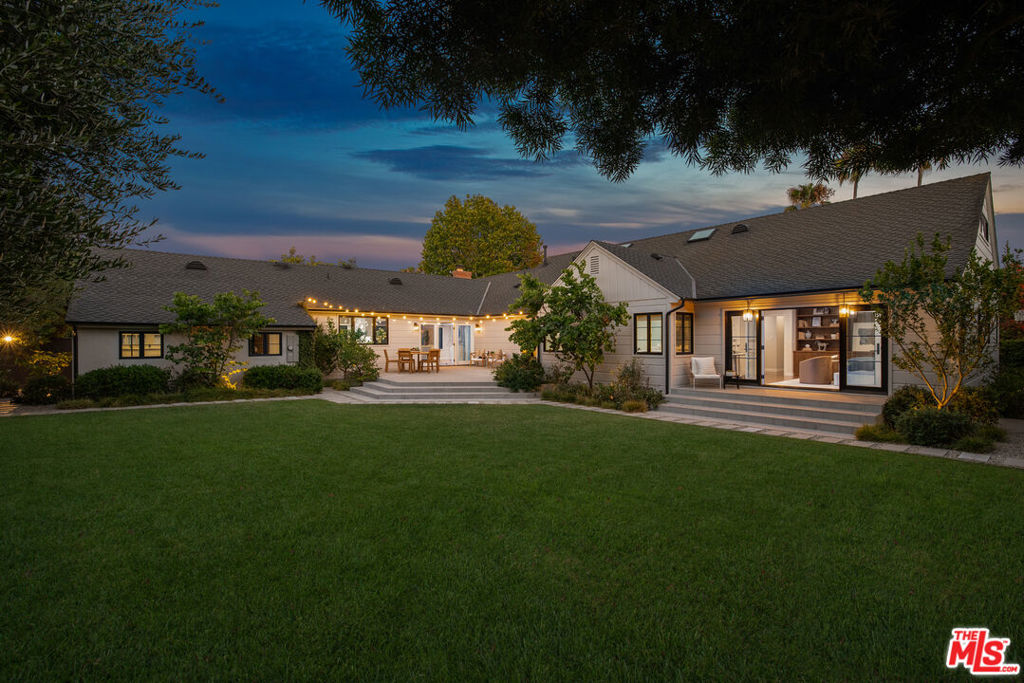 Truly a rare offering..! Coveted and highly sought after Huntington Palisades, recently and meticulously fully renovated 3,445 square foot single-level ranch-style home set on a sprawling and close to 14,000 square foot expansive corner lot. Luxurious Southern California coastal indoor-outdoor living, high-end designer finishes boasting modern amenities; four generously sized bedrooms, four bathrooms and a very large den/office that is recorded as the fifth bedroom. Hardwood oak floors throughout, Marvin windows, and strategically placed skylights, all working together to create light-filled open and inviting living spaces. The fully outfitted chef's kitchen is a culinary dream featuring stunning honed marble countertops, a large center island, custom cabinetry/hardware, Miele dishwasher, sixty-inch full-sized side by side paneled Sub-Zero refrigerator/freezer, and a sixty-inch Wolf range with two full sized Wolf ovens, griddle and six burners.Ideal for entertaining and the Palisades lifestyle with a seamless indoor-outdoor flow, the property offers an expansive back patio, ideal for dining al fresco or hosting large-scale gatherings while overlooking a vast grassy lushly landscaped secluded backyard that is swimming pool and spa ready. Also enjoy olive, fig, lemon, lime, and mandarin trees, plus a separate yard which hosts a versatile large sports court, perfect for basketball, pickleball and other activities.The primary suite is a serene escape, featuring custom solid wood built-ins, French doors opening to another patio adjacent to the backyard, and an elegant ensuite spa-like bathroom showcasing a freestanding soaking tub, and marble floors, countertops, and oversized shower. The guest bedrooms feature oversized closets, large windows, and custom solid wood built-ins. The powder room boasts a custom solid wood floating vanity and sleek quartz countertop. A spacious living room centered around a cozy gas fireplace and adjacent formal dining room both featuring large windows looking out to the manicured front landscaping. The large two-car garage and full-sized driveway provide convenient off-street parking.Pacific Palisadesis acozybeach town, and 14903 Pampas Ricas is situated in one of the most prestigious neighborhoods west of the 405 freeway, just steps to the all-new Caruso PalisadesVillage, which offers high-end boutique shopping, movie-theater, artisan coffee/ice cream shops and award-winning fine dining and restaurants. Also nearby is the Palisades Recreation Center, Park, beach, bike path and hiking trails. Some nearby schools are Palisades Charter High School, Palisades Charter Elementary School, Village School and Seven Arrows, just to name a few. Pacific Palisades is one of the last coastal neighborhoods with a true small beach town feel.
