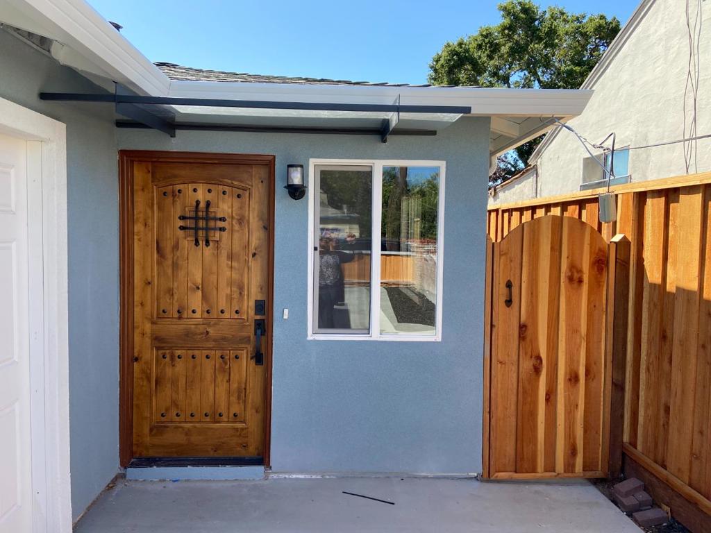 Welcome to this charming home located in East Palo Alto. Completely remodeled in 2020 from ceiling to floor, including new roof, windows and doors. Turnkey ready with 760 square feet of well-utilized space. This residence offers two comfortable bedrooms and one full bathroom. The kitchen is a standout feature, designed with a modern granite countertop, convenient island, and equipped with a gas oven range, hood over range, and garbage disposal, making meal preparation a breeze. Laminate flooring runs throughout the home, providing durability and easy maintenance. For your comfort, the home is equipped with a ceiling fan for cooling and central forced air - gas heating. Laundry facilities are conveniently located in the garage with an electricity hookup (220V). Don't miss the opportunity to own this lovely property on the Peninsula.