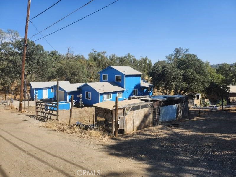 As the classic song goes "Give me land lots of land don't fence me in" This is country living at it's best! Located at the end of a very quiet street this farmhouse is filled with charm and tons of usable space inside and out! 4 total parcels make up this very impressive landscape. the current owners have been raising pigs, chickens and cows. The area is surrounded by shade trees. Needless to say there is ample parking for all your toys. The house itself is very impressive too. 3 good sized bedrooms plus a bonus room that can be used as an office or an additional bedroom if you choose to do so. This property has been very well maintained and really needs to be seen to be fully appreciated.