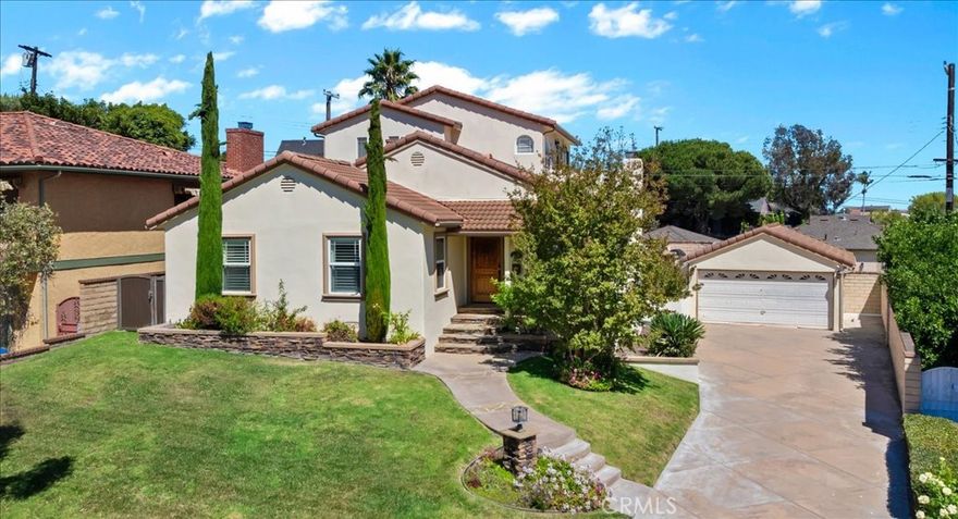 HUGE price reduction! Captivating curb appeal on this amazing property in one of San Pedro's most desired locations!  Originally built in 1951, this home underwent a major remodel and addition in 2005 and offers all the modern conveniences you would expect from a newer home. The attractive exterior offers a cozy, warm feeling with smooth stucco walls, red tile roof, natural stone accents and lush landscaping. The magnificent kitchen truly is the heart of this home and features custom cabinetry, island with vegetable sink, quartzite counters, white farmhouse sink, large pantry, Viking and GE Monogram appliances (including a six burner 48''dual fuel gas burning range) and a breakfast bar which opens to the family room. The family room has high soaring ceilings and two sliding glass doors that lead out to the sun filled backyard. Also on the entry level are the two secondary bedrooms and two refreshed bathrooms. Upstairs you will find the exquisite primary suite, featuring a vaulted ceiling, large windows and a sliding glass door that opens up to a wrap around terrace where peek-a-boo views of the harbor can be enjoyed. The huge master bath offers high-quality finishes that include Carrara marble, Whirlpool bath, steam shower and a skylight. There is also a spacious walk-in closet with another skylight. Outside the master suite is the loft area that makes a perfect work space and the laundry room with built-in cabinetry. Gleaming hardwood floors in a warm espresso finish run throughout the designer-perfect interior. Additional features include plantation shutters, recessed lighting, separate heat/ac system for each level, tons of built-in storage and a large attic area that is tall enough to walk around in. The dreamy backyard is perfect for entertaining and hosting family gatherings. It offers an outdoor kitchen (with built in bbq, side burner, refrigerator and bar) stamped concrete patio, sitting area with pergola, a grassy area and new exterior lighting. The two car detached garage has a finished interior and there is driveway parking for another handful of cars. Just a few blocks away is one of San Pedro's treasures, Averill Park. This is a gorgeous home in a prime Vista Del Oro location, come take a look and don’t miss out!