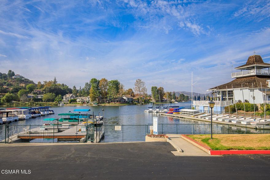 Welcome to SUMMERSHORE Upper level Single Story Townhome in desirable location, across from the Westlake Landing with shops and restaurants. This Updated 2 bedrooms, 2 full bathroom is tucked away in the back on a corner next to ancient oak tree. Gorgeous Kitchen with new quartz counters, new sink, new microwave oven. Living room with fireplace and sliders to large private enclosed patio. Spacious Master with large walk-in closet and bathroom, vanity and stall shower. Generous sized secondary bedroom with hall bathroom. Laundry in unit plus separate 2 car garage. Community pool & spa to relax/recharge. Located within award winning school district. Wood floors, fresh paint, scraped ceilings, bright, open and spacious interior.