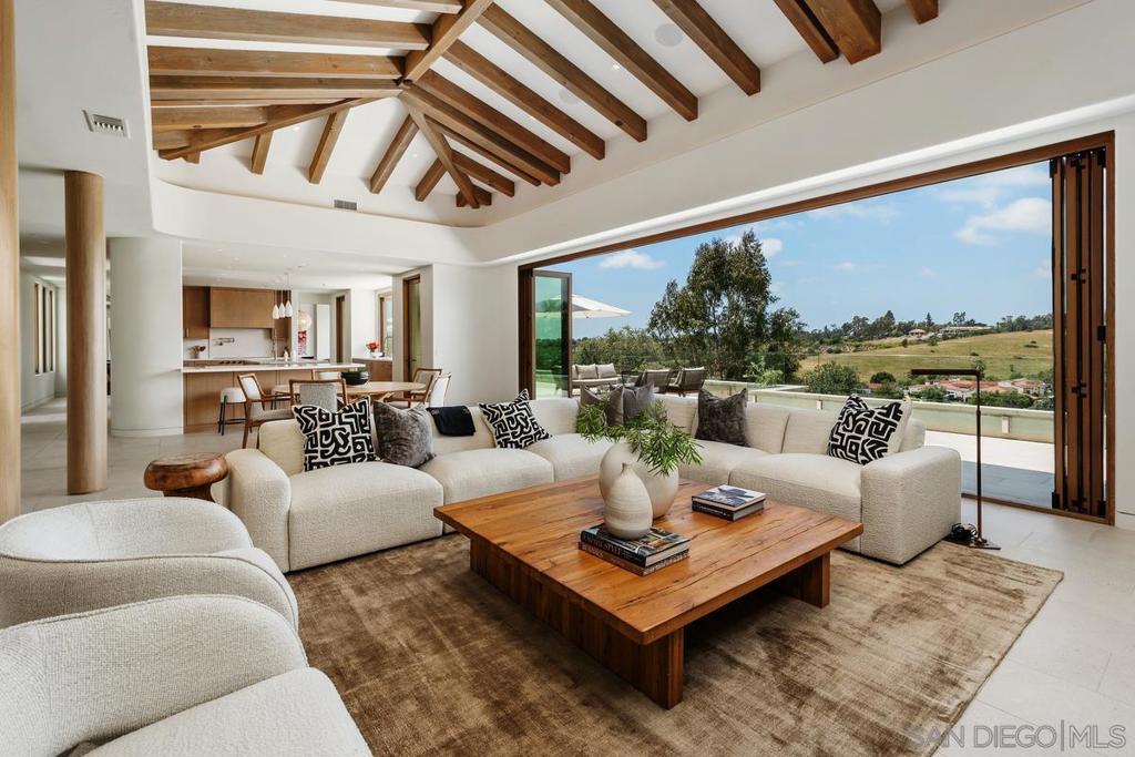 New Custom Built Estate 2020, offers a beautiful blend of modern architecture w/ natural textures, creating an ideal Southern California setting. Timeless aesthetic frames picture-perfect VIEWS effortlessly & walls of glass disappear achieving seamless indoor/outdoor living; enjoy gentle ocean breezes & sunsets out by the fire-pit. The open living offers luxurious finish details, including one touch lighting “smart home”, security, stunning gourmet kitchen & separate dining area for those special occasions. Most of the everyday living is all on one level & sumptuous primary suite offers a spa bath normally only found in Five Star Spas plus a large boutique walk-in wardrobe. The addition of a Professional Gym with outdoor massage area & separate Media Room makes it so you never have to leave. The main home offers 5+ bedroom suites plus your guests will enjoy the 2 Detached Guest homes. The bonus area off the pool offers a seamless glass temperature-controlled wine room which looks like a piece of art & also ideally situated adjacent to the sit-down bar. Landscape architect, Theresa Clarke, adds additional beautiful landscape elements to frame the stunning home, raised gardens for farm to table eating plus added well water & surrounding pool area is a luxurious space even with the pool bath offering a full-size steam shower. This beautiful retreat/estate is situated off a long driveway & fully fenced and gated in one of the very best locations within Rancho Santa Fe Covenant: walk to golf, clubhouse, school & close to everything.