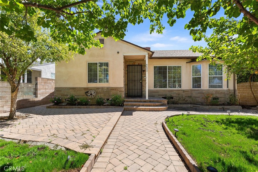 This beautifully maintained North Hollywood gem offers the perfect combination of charm, functionality, and income potential. The property features a spacious 3 bedroom, 2 bath main house with approximately 1,666 square feet of thoughtfully designed living space, along with a fully detached 1 bedroom, 1 bath ADU offering an additional 681 square feet ideal for rental income, extended family, or a private guest retreat. Once inside the main home, discover a warm and inviting atmosphere, highlighted by a cozy fireplace in the living room, elegant recessed lighting throughout, and bright, generously sized bedrooms that provide comfort and privacy for the whole family. The layout is both practical and stylish, perfect for everyday living and entertaining alike. The detached ADU offers its own private entrance and versatile layout, making it a perfect space for a home office, creative studio, or long-term rental. Whether you're an investor, a multigenerational household, or simply seeking flexible living options, this property delivers on all fronts.
Nestled in a highly desirable pocket of North Hollywood, you're just minutes from local schools, shopping, dining, and easy access to major freeways. This is a rare opportunity to own a move-in-ready home with built-in versatility in one of the San Fernando Valley's most sought-after neighborhoods.