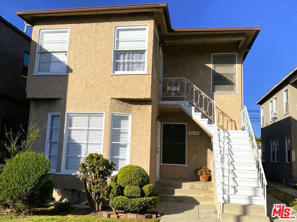 Bright, Spacious Top Floor Unit for Lease! You will be the first tenant to enjoy this newly renovated, updated and freshly painted 2-bedroom duplex apartment in prime West LA, set way back from the road on a large lot, for added privacy. This unit features newly refinished, gleaming hardwood floors throughout, new heating units, ceiling fans, and window treatments. The bright living room includes a bay window and flows seamlessly into the open-plan dining area. The just-remodeled kitchen offers generous cabinet and counter space, sparkling newly resurfaced countertops, double sinks, disposal, and brand new stainless steel gas appliances (see photos). New, full-size washer/dryer has been added in the service porch & the side exit leads downstairs to the side patio and private access to a the garage with auto door & storage. To the rear of the home are 2 large, sunny bedrooms with neighborhood views and ample space for a large bed + office/or sitting area, new ceiling fans, door hardware, and spacious closets. The newly remodeled bathroom includes a pristine sink, cabinets, hardware, new mirrors, new commode, and a re-enameled tub and tile surround. 2618 Barrington Ave. offers a spacious living environment that feels like a home and is super close to all that the Westside has to offer and easy access to the 405 and 10 freeways. All of this and a public EV CHARGING STATION directly in front of the unit. Pets may be allowed on a case by case basis.