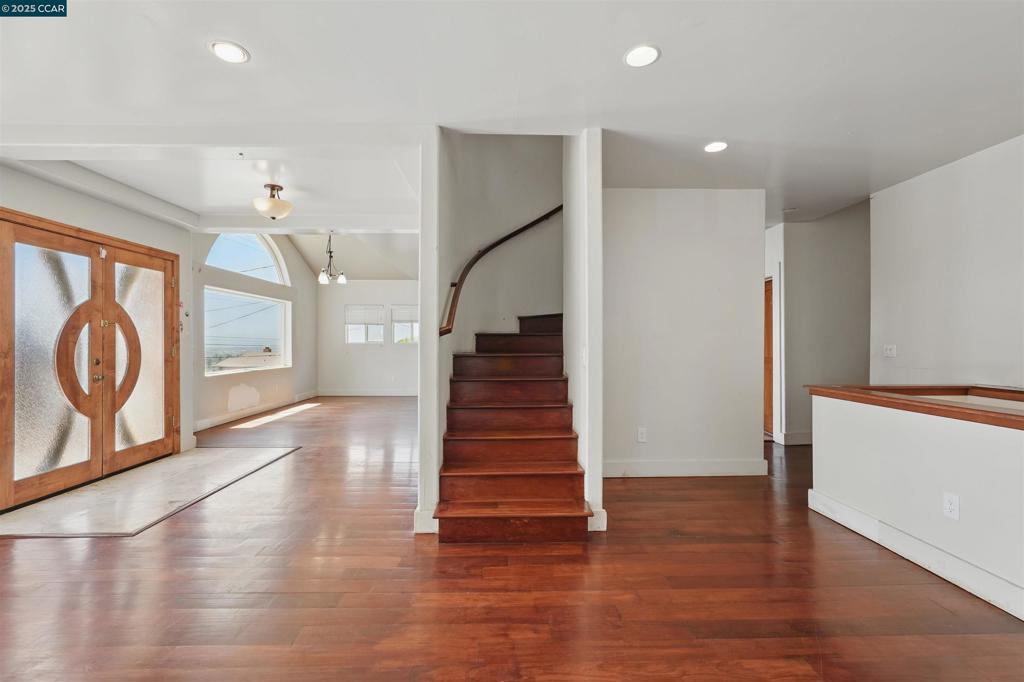 Sweeping Bay views and glimpses of the SF skyline make this multilevel 4 bed, 4 bath home perfect for July 4th fireworks. Three bedrooms feature en-suite bathrooms. Spacious living and dining areas lead to a large open kitchen ready for your dream design. Bonus flex room with side yard access-ideal for office or workshop. Detached structure offers ADU, gym, or studio potential. A rare blend of views, space, and flexibility.