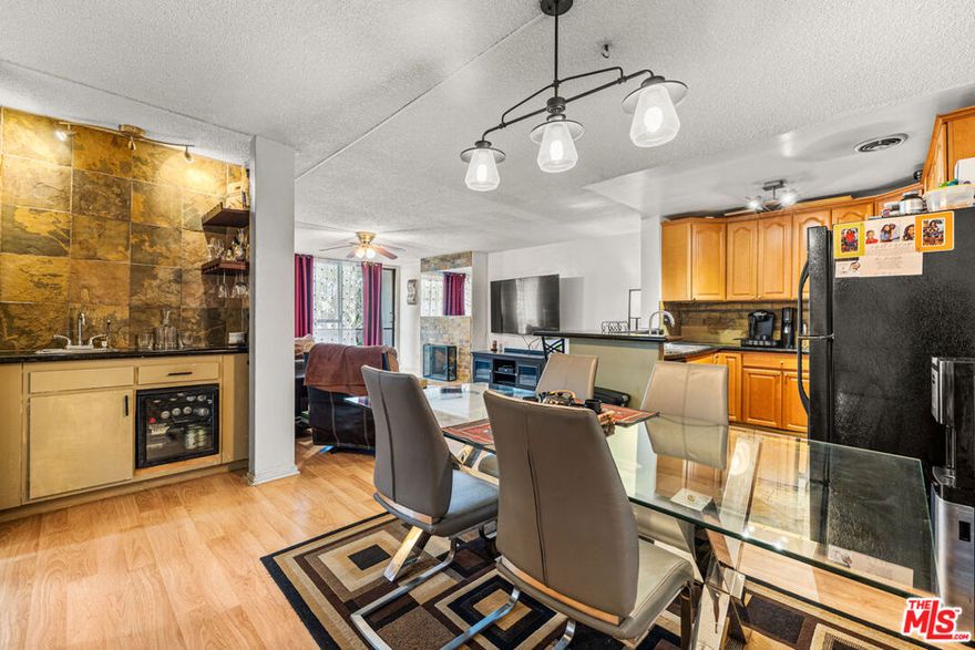 Located on the second floor of the Heather Village complex in Culver City's lush Fox Hills community, this beautifully updated 2-bedroom, 2-bath condo combines modern comfort with resort-style amenities. The open-concept kitchen features solid wood cabinets, granite countertops, a wine refrigerator, and bar seating, flowing seamlessly into a spacious living area with engineered wood floors and a brand-new fireplace mantle. Both bedrooms offer generous closet space, while the upgraded bathrooms include granite countertops and a professionally tiled master shower with a built-in bench. Step out onto the private balcony and enjoy peaceful views of the community's beautifully landscaped grounds. Two convenient covered parking spaces - one directly beneath the building (Space 174) and another near the tennis court (Space 724). Heather Village offers an exceptional array of amenities, including three pools, wet and dry spas, a tennis court, children's playground, Montessori school, clubhouse, recreation room, a newly remodeled fitness center, and 24-hour security. The HOA covers gas, cable, high-speed internet, water, and two covered parking spaces. Perfectly situated near LAX, Playa Vista, Marina del Rey, Downtown Culver City, Fox Hills Park, and Westfield Mall, with easy access to the 90 and 405 freeways, this condo offers the best of Westside living in a vibrant and well-maintained community. (New electrical breaker panel has been installed in all of the units, HOA is in the process to upgrade to central heating and A/C)