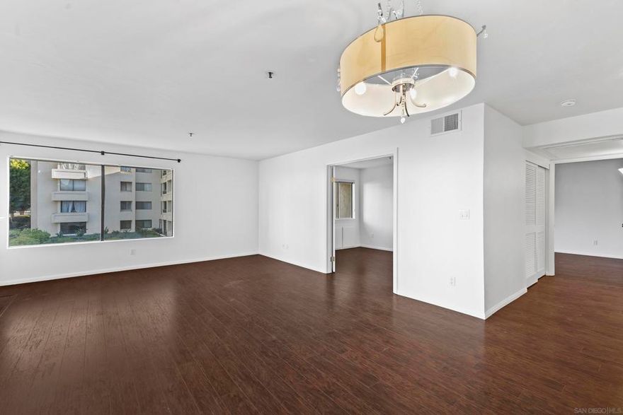 Available Now! This uniquely positioned corner unit gets lots of natural light and a view of the water feature! This spacious and freshly painted condominium with  central a/c has 2 full baths, a gas fireplace and a great front facing balcony with an extra storage closet. Primary bedroom has an ensuite bath and a walk in closet! El Dorado Greens is one of the only complexes in the area that provide a wide selection of amenities for no extra charge, including internet, cable, water, sewer, and trash! A beautiful community pool, jacuzzi, and tennis courts are just steps away. One reserved underground parking is included and another space for uncovered parking is permitted. Street parking is also nearby and free of charge.