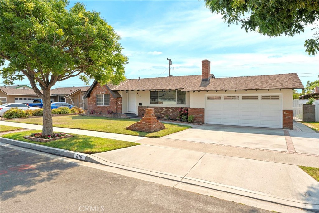 THIS IS IT! Looking for a cozy, fresh, remodeled home in a bright, welcoming neighborhood at the end of the cul-de-sac? Look no further! Welcome to 819 S Courson Dr, a tastefully updated 3-bedroom, 2-bath home offering 1,691 square feet of living space on a spacious 7,200 square foot lot. Curb appeal? Check. Manicured yard? Check. Playing basketball in the street? Absolutely! From the moment you arrive, you’ll notice how well cared for and inviting this home is. Step inside to a warm living room filled with lots of natural light, a large front window, and a brick fireplace that adds charm and comfort, perfect for relaxing or hosting during the holidays. The open dining area sits at the heart of the home, connecting the family room and kitchen while overlooking the green backyard, ideal for everyday living or entertaining. Have kids? Pets? They'll love the backyard. Fully fenced and lined with fruit trees and garden planters, it's ready for your best seeds to grow. The kitchen has been completely reimagined with new stone countertops, self closing cabinets and drawers, modern hardware, a deep stainless steel sink with a pull-down faucet, and a premium oversized Cosmo dual stainless steel gas range featuring 6 high-performance burners, a built-in griddle, 2 ovens, convection settings, and a sleek digital display. Topped with a commercial-grade stainless steel range hood, this kitchen is ready to impress any home cook. But that’s not all, on the other side of the home, you’ll find three comfortable bedrooms, two fully remodeled bathrooms, and a spacious family room with sliding doors leading to the backyard. And yes, the family room has its own fireplace too! Out back, enjoy a low maintenance green yard with a covered patio and plenty of space to relax, garden, or host friends and family. Additional upgrades include recessed lighting, new flooring, fresh interior and exterior paint, new doors, windows and more. The attached two-car garage adds convenience, and the extended driveway provides plenty of parking. Don't forget the street is a cul-de-sac, so kid's friendly! Located close to schools, parks, shopping, and major freeways, this home is updated, practical, and move-in ready. For your peace of mind, the seller is including Termite Section 1 clearance and one full year of upgraded home warranty coverage—buyer’s choice. Don’t miss this one!