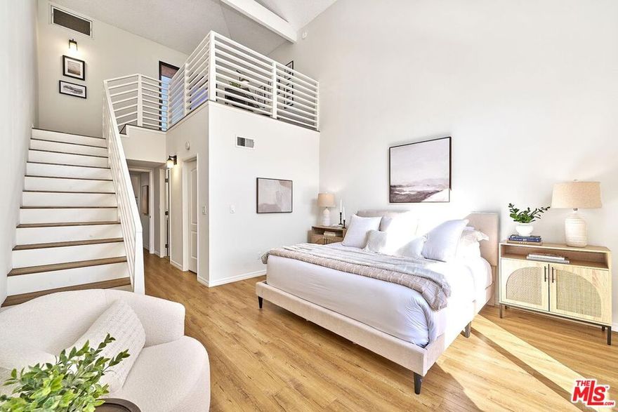 Located in the heart of the NoHo Arts District, this spacious end-unit townhome is just moments from theaters, cafes and some of the area's most popular restaurants. The open living and dining area is filled with natural light and flows seamlessly into an updated kitchen with granite countertops, ample cabinetry, and stainless steel appliances, making it ideal for both everyday living and entertaining. Upstairs, you'll find two bedrooms, including a primary suite with a soaring ceiling, walk-in closet  with an en-suite bath and an attached loft that opens to a private outdoor deck. Additional highlights include a direct-entry 2 car (tandem parking) garage, a convenient powder room on the main floor, generous storage, and washer and dryer. Step outside and enjoy neighborhood favorites such as Superba, Amp, and Cara Vana for your morning coffee, plan a gourmet dinner with fresh selections from The Seafood Shop or grab tacos nearby before meeting friends at Haley's Wine Bar, Lawless Brewing or Ready Player One Arcade all within 5 minutes of your new home.