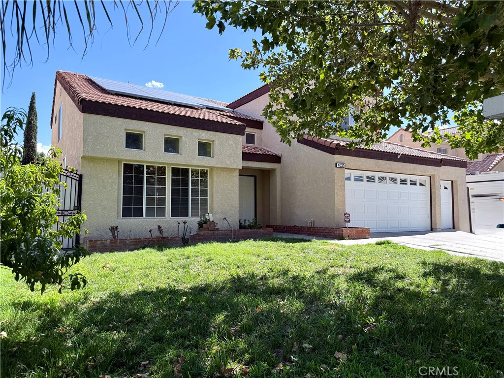 Step into this well maitained updated 5-bedroom, 3-bath home with approximately 2,700 sq. ft.of living space in a quiet Palmdale cul-de-sac street. The main floor features a formal living room with high ceilings and formal dining area. The updated kitchen is a true highlight, featuring granite countertops, an island, plenty of cabinetry, and it opens seamlessly to the family room with fireplace. Includes on the main floor a spacious bedroom and three-quarter bath, perfect for guests or extended family. The beautiful staircase leads to the private quarters upstairs offers two bedrooms and a spacious master suite with a beautiful spa like private bathroom.
Outdoors, enjoy a large covered patio ideal for entertaining and a three-car garage for ample storage. The home has been recently renovated and is move-in ready. Solar panels help keep utilities low, with rent including water, trash, and gardening service—tenant only covers gas, electricity and any Edison overages. This spacious, well-maintained home is ready for the right tenant seeking comfort, convenience, and peace in a family-friendly neighborhood. Call listing agent for tenant requirements and details.