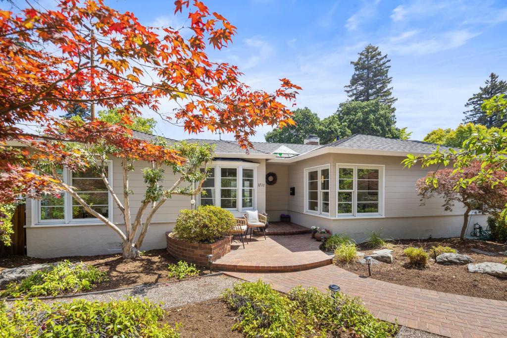Welcome to a beautiful Leland Manor home. The expansive living room has a fireplace and sliding glass doors leading to an inviting patio and garden. A wood staircase with a beautiful wall mural leads to a Primary bedroom. There are two bedrooms, and a den or office on the first floor. A large kitchen with adjoining dining and breakfast areas opens onto the Rose-Azalea garden with tranquil sitting areas. The landscaping is by the late Page Sanders. In moved-in condition, freshly painted, and with gleaming hardwood floors, the house invites you to enjoy Palo Altos unmatched living. 1711 Guinda Street lies within walking distance of Rinconada Cultural Park, with tennis courts and playgrounds; the Palo Alto Art Center; Lucie Stern Community Center; Palo Alto Junior Museum and Zoo; and the highly-rated Walter Hays Elementary School.