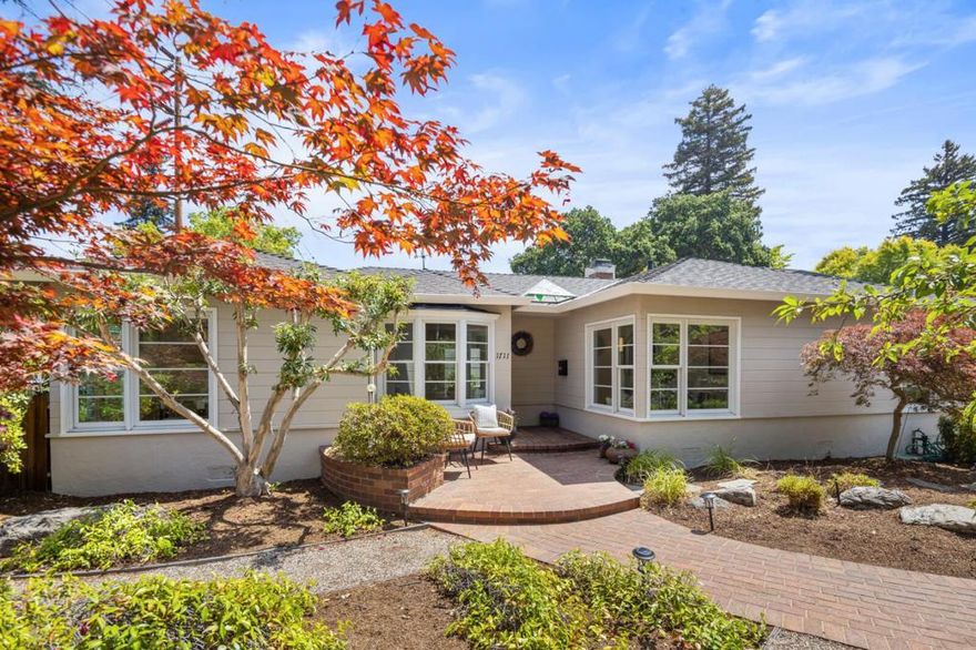 Listing Price is reduced $395,000. Open House from 1- 4 every weekend. Welcome to a beautiful Leland Manor home.  The expansive living room has a fireplace and sliding glass doors leading to an inviting patio and garden. A wood staircase with a beautiful wall mural leads to a guest suite with a separate entrance.  There are two bedrooms, and a den or office on the first floor. The attic has an additional storage. A large kitchen with adjoining dining and breakfast areas opens onto the Rose-Azalea garden with tranquil sitting areas. The landscaping is by the late Page Sanders. In moved-in condition, freshly painted, and with gleaming hardwood floors, the house invites you to enjoy Palo Altos unmatched living. 1711 Guinda Street lies within walking distance of Rinconada Cultural Park, with tennis courts and playgrounds; the Palo Alto Art Center; Lucie Stern Community Center; Palo Alto Junior Museum and Zoo; and the highly-rated Walter Hays Elementary School.