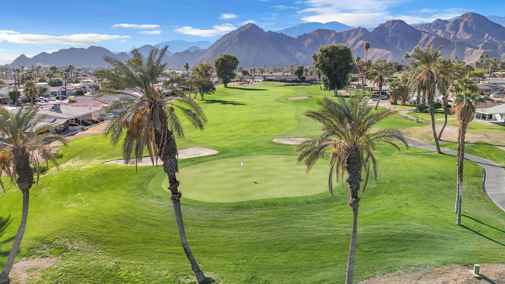 Welcome to this charming 2-bed, 2-bath home located on a desirable corner lot in Palm Desert Country Club. This single-level residence offers an open-concept floor plan with a spacious living and dining area, making it ideal for entertaining. The kitchen features generous counter space, newer appliances, and plenty of natural light.Step outside to enjoy the large, pool-sized backyard with mature landscaping and a covered patio--perfect for relaxing or creating your own outdoor oasis. The home sits on the green within a golf course community, giving you scenic surroundings and easy access to recreation.Additional features include ceramic tile flooring throughout, a 1-car attached garage, and low annual HOA dues that provide access to a community clubhouse, pool, and spa. Conveniently located near shopping, dining, and top-rated schools, this home offers excellent potential for investors, full-time residents, or as a seasonal getaway.