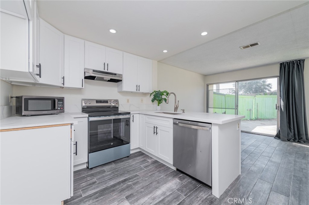 Welcome to 952 Pinyon Ct in the gated Charter Village Green community! This well-designed home features a spacious living room, a newly remodeled kitchen, and a large dining area — perfect for everyday living. Both bathrooms have also been recently remodeled, and fresh paint throughout makes the space feel brand new. Wood-look tile downstairs and laminate flooring upstairs create a stylish, low-maintenance home. Central A/C, heating, and ceiling fans keep you comfortable year-round. Upstairs, two bedrooms share a full bath. The primary bedroom is large enough for a full set and even a home office desk. The laundry area is conveniently located between the entry and garage — toss in jackets as you walk in! Direct garage access and an assigned second parking spot make daily life easy. Enjoy the larger private backyard — great for grilling, relaxing, or play — and cool off in the sparkling community pool. HOA covers trash service, too! Located near Bryant Park, Elderberry Elementary, Vernon Middle School, and Ontario’s charming historic downtown — all within minutes. A great home in a convenient location — come see it for yourself!