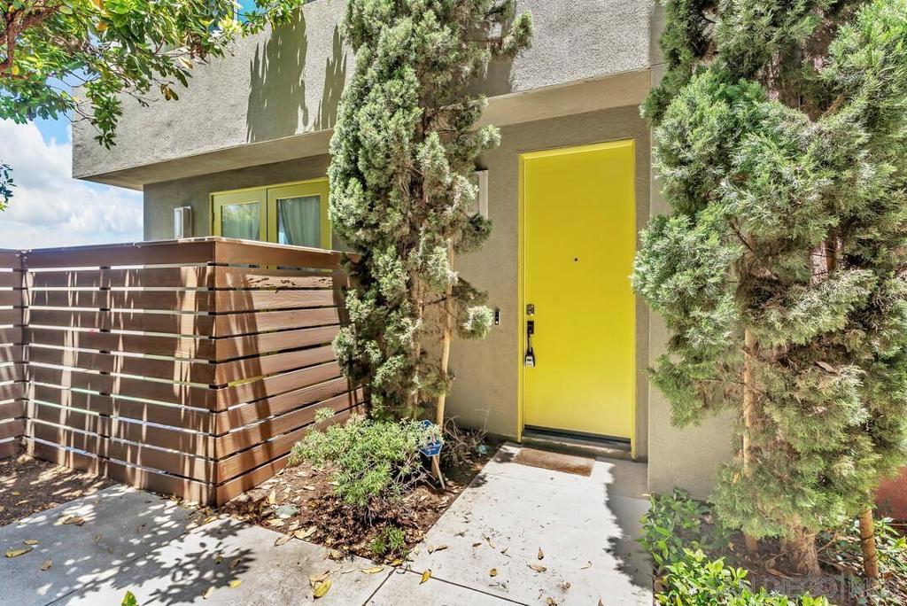 Stunning large END unit with private yard and AMAZING bay and downtown skyline views! One of the largest floor plans in this community, this home has 4 bedrooms, 2 full & 2 half baths, including an entry-level bedroom, with custom features throughout the house. PAID Solar and EV charging station in garage, new HVAC capacitor, and dual pane vinyl windows make this home energy efficient. Enjoy a convenient bedroom with a custom slide-down door & 1/2 bath on the 1st floor, perfect for guests or an office. Upstairs, you're greeted with an open room concept kitchen, dining, & living room area with views of the bay and downtown San Diego from end to end! Kitchen features custom backsplash, oversized island with waterfall quartz countertops, updated light fixtures, and stainless steel appliances. On the 3rd floor, the generous master suite is on one side of the home, and 2 bedrooms are on the other, ensuring privacy in your master retreat. Extra-large master bathroom includes an oversized shower with custom tile, and two large vanities, as well as sweeping views of the bay and Coronado Bridge. Both secondary bedrooms are generously sized and share an updated bathroom. Other features include luxury vinyl plank flooring throughout, including bedrooms, 2 car garage with epoxy floor and EV charging, OWNED SOLAR SYSTEM, and high-speed, alarm system, hardwired internet throughout. Low HOA fee provides for amenities including a pool and BBQ grilling area. Located within walking distance to the new 'Chula Vista Bayfront' development and easy freeway access makes this location ideal!