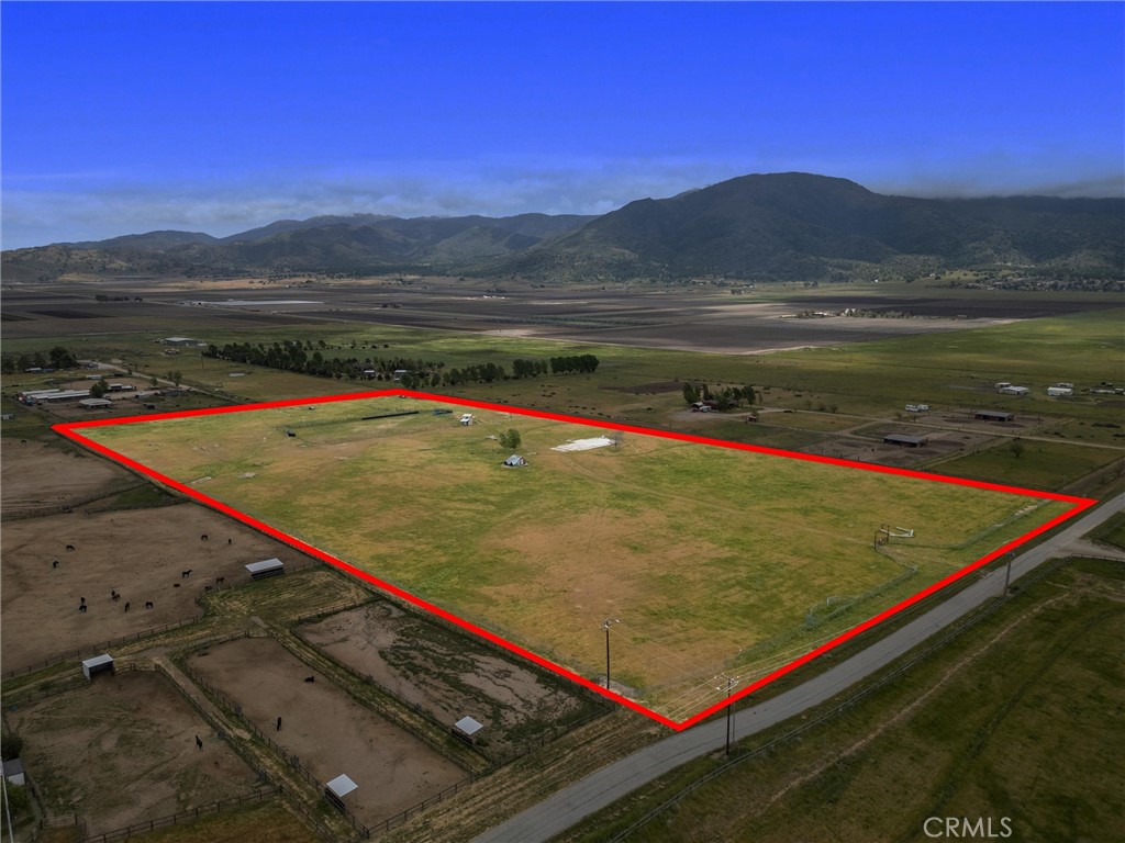 **Ranch Home Opportunity** This listing highlights an exceptional opportunity to acquire a 20-acre agricultural property with significant advantages for rebuilding. Previously featuring a 3,205 sq ft home that has been removed, this property allows for a new construction of the same size with reduced costs due to waived impact fees linked to the former structure. Key features include: Existing well for water supply, fully fenced premises & additional fencing suitable for horses and cattle. Don't miss the chance to invest in this prime location, perfect for agricultural use or equestrian activities. Call today for more details and to discuss your options!