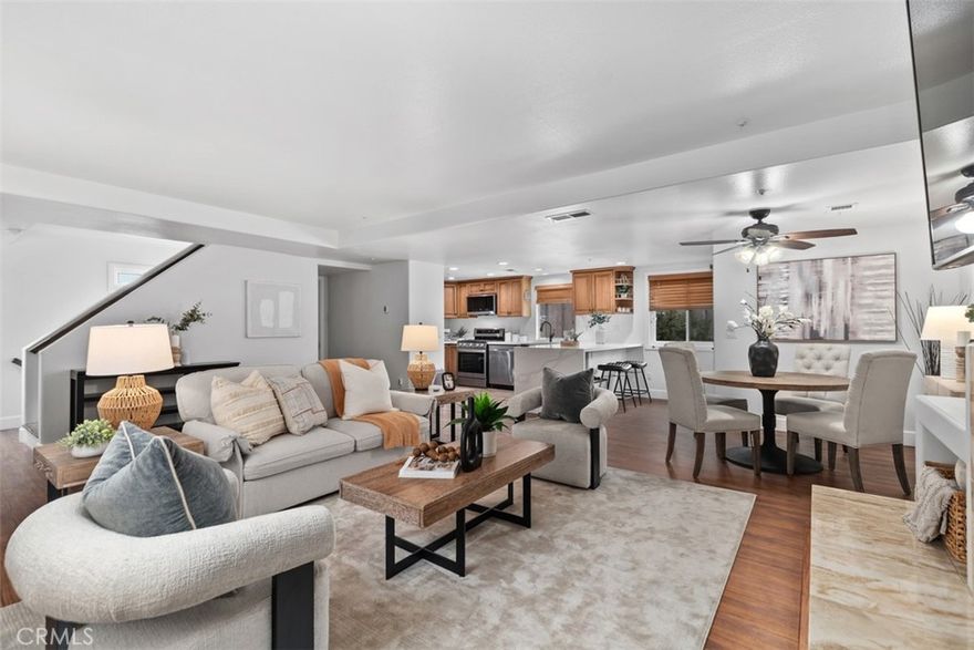 Situated on a quiet cul-de-sac just minutes from the beach, this Huntington Beach townhome offers the perfect balance of coastal convenience and neighborhood charm. With easy access to shopping, dining, schools, and major freeways, the location delivers true surf-city living with everyday ease.
This Mediterranean-style front, end unit features an open floor plan with an updated kitchen showcasing granite countertops, stainless steel appliances, and wood flooring in the kitchen and dining area. Newer dual-pane windows with wood blinds enhance comfort and efficiency, while the living room is anchored by a cozy gas log fireplace.  

Upstairs are two spacious primary suites, each with vaulted ceilings and a full en-suite bath. A conveniently located powder room serves the main living level. One of the home’s highlights is the private rooftop deck, ideal for entertaining, relaxing, or enjoying special events and airshows. Additional outdoor space includes a wood-fenced ground-level patio and garden area.

A large two-car garage offers ample storage and a separate laundry area with gas and electric hookups. A private exterior staircase provides access to all levels, including the rooftop deck. A rare opportunity to enjoy a unique floor plan, multiple outdoor spaces, and a prime Huntington Beach location.