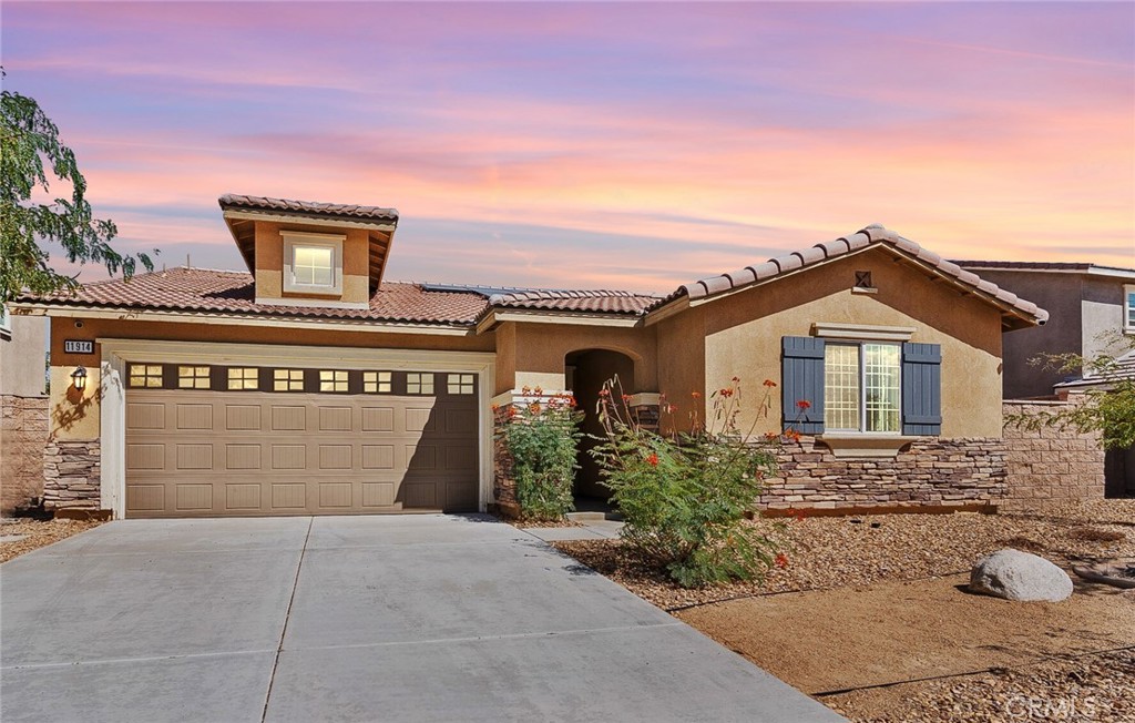 Welcome to this charming 3-bedroom, 2-bathroom home located in a desirable Victorville neighborhood. Designed with comfort and convenience in mind, this property features an open floor concept highlighted by a spacious great room that seamlessly blends living and dining areas—perfect for family gatherings or entertaining. The primary suite offers a private retreat with its own bathroom, complete with dual sinks, a relaxing soaking tub, a separate stand-up shower, and a walk-in closet. Additional bedrooms provide versatility for family, guests, or a home office. With its modern layout and prime location located near Hwy 395 and local shopping centers - this home makes it a fantastic opportunity for anyone looking to enjoy both comfort and style in Victorville.