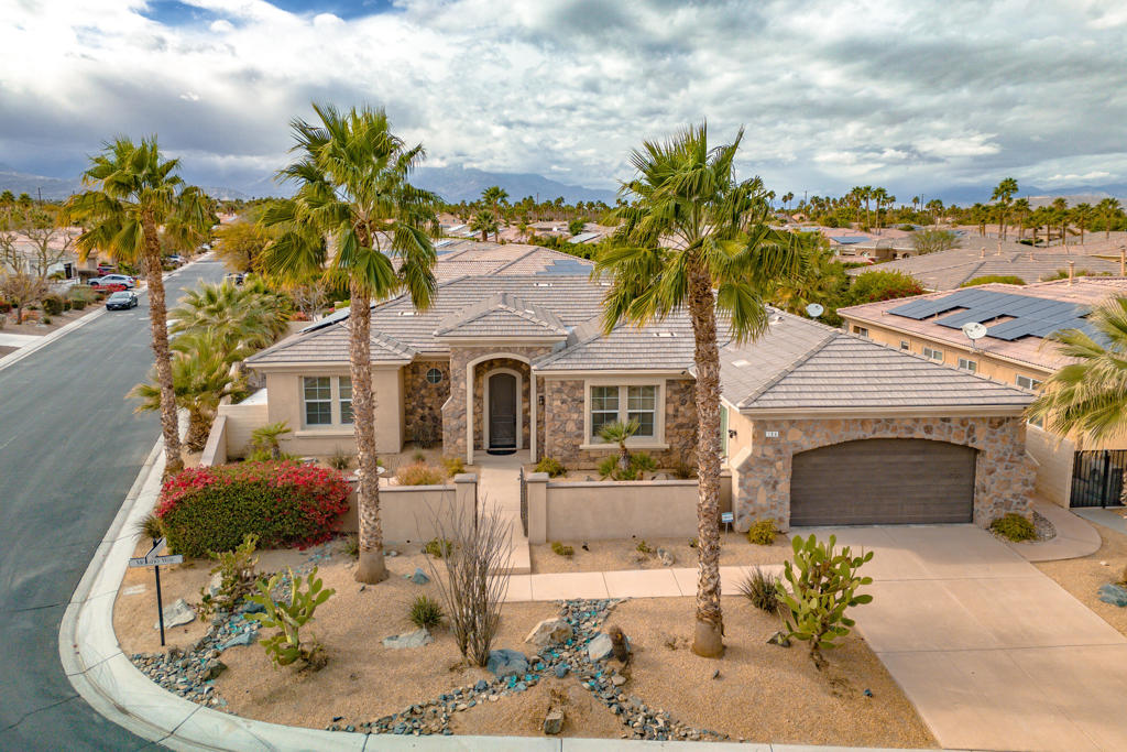 Gorgeous Mediterranean Designed Pool Home In Brenna At Capri with OWNED Solar. This spacious 4 bedroom and 3 bathroom home has high ceilings throughout along with abundant natural lighting. Resting on a large corner lot, this home has great indoor and outdoor amenities. The luxurious kitchen with stainless steel appliances, a pantry & island opens to the living room with soaring ceilings. Living room features a fireplace plus access to the outdoor living with covered patio. Adjacent to the living room, find the cozy den and wet bar. Large master suite has a walk in closet plus full bathroom featuring a separate tub and shower along with dual vanities. Two of the three guest bedrooms feature a Jack and Jill bathroom in between them. The outdoor living space has a large pool and spa, ample decking to entertain, a custom BBQ and palapa area plus a separate firepit. Brenna @Capri has low HOAs dues and is conveniently located on Country Club. We are minutes from lots of great shopping and dining. Call me today for additional details