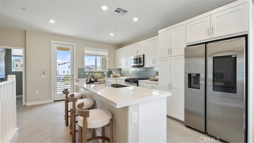 Coral Plan 1 at Valencia by Lennar offers 1,326 sq. ft. of thoughtfully designed living space, featuring 2 bedrooms, 2.5 bathrooms, and a 2-car tandem
garage. This new three-story home features an inviting open-concept layout on the second floor where the kitchen, dining room and living room meet.
A nearby deck provides convenient indoor-outdoor experiences. A comfortable bedroom shares the third story with a lavish owner’s suite that offers
access to a full bathroom, walk-in closet and private deck. Located within Valencia’s master-planned community, residents enjoy access to pools,
parks, scenic trails, and more.