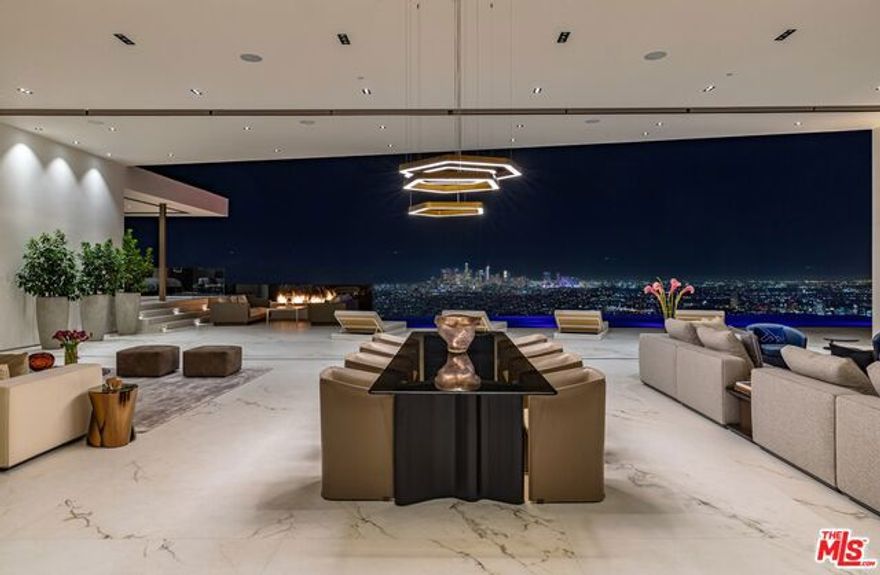 The pinnacle of excellence. Style, sophistication and elegance infused in this 17,000 square-foot masterpiece with the most explosive views that Los Angeles has to offer. The only budget was there was no budget, it had to be the best. Architecture that inspires by XTEN blended with the latest & greatest amenities and stones that were curated across the globe. Kitchen by Armani/Casa, chef's kitchen by Dada, bathrooms by Boffi, bar and wine cellar by Armani/Casa. This house desires the best both of worlds; a woman's soft touch with a mature masculinity. The absolute best bird of all the streets, Robin Drive.