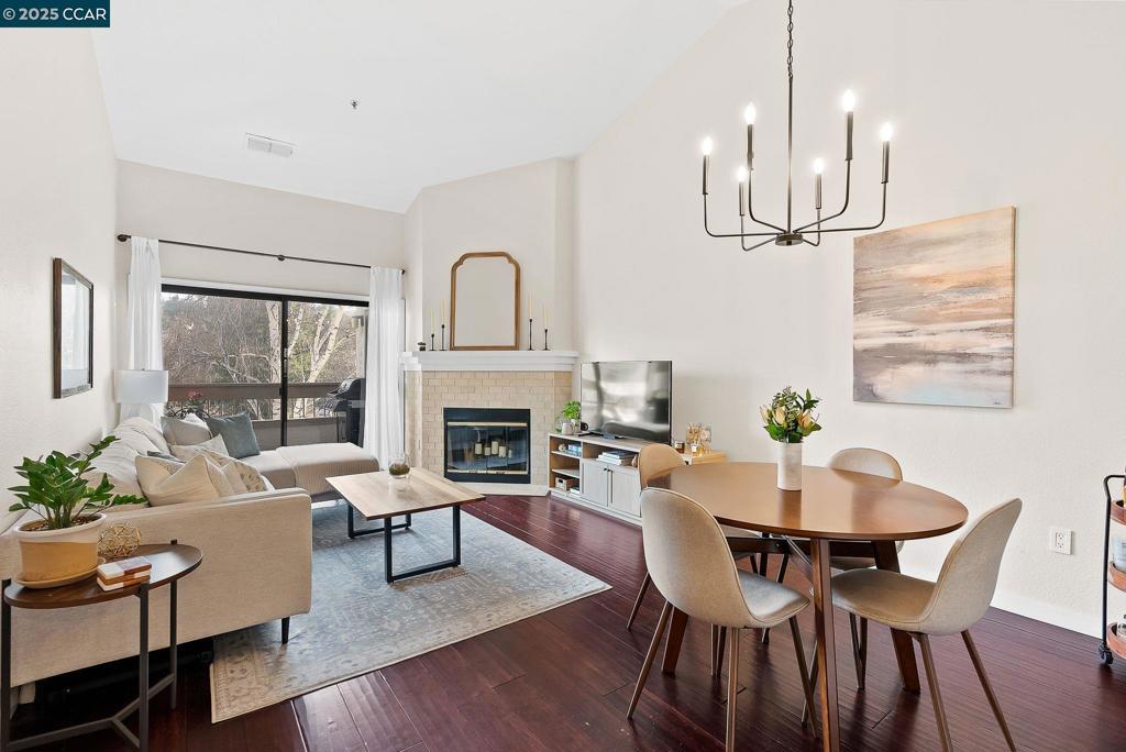 Welcome to your serene retreat. This top-floor unit offers a peaceful living experience with no upstairs neighbors and minimal noise, making it an incredibly quiet haven. Spanning 895 square feet, this modern condo boasts two spacious bedrooms, each with en-suite bathrooms, providing privacy and comfort. Step inside to discover vaulted ceilings and abundant natural light that accentuate the open living space. The remodeled kitchen is a chef's delight, featuring granite countertops, a custom built-in pantry, and new stainless steel appliances, including a convection microwave and a new disposal. The bamboo hardwood floors add a touch of elegance, while the Nest thermostat and Ring camera enhance your convenience and security. Enjoy the cozy ambiance of a functioning fireplace and take in the breathtaking view of Mt. Diablo from your private patio. The unit is affectionately known as the "treehouse" during spring and fall, surrounded by lush greenery and elevated walkways. Additional highlights include a new washer/dryer, central heat and AC, ample closet space, a walk-in shower with a new shower head, & new light fixtures and hardware. Walking distance to downtown Walnut Creek, offering easy access, offering easy access to shopping, dining, a entertainment.