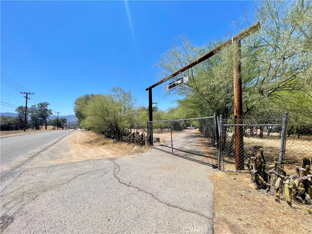 Rare opportunity in Lake Elsinore! This charming 2-bedroom, 2-bath manufactured home sits on a generous 1.74-acre lot — perfect for those seeking space, privacy, and endless potential. With 1,440 sq ft of comfortable living space, the home features a cozy fireplace, a functional kitchen, and central A/C for year-round comfort.
What makes this property even more special? It includes a detached secondary unit, ideal for guests, a private home office, workshop, or rental unit. This added flexibility opens the door to multi-generational living, supplemental income, or creative business use.
Enjoy the tranquil ranch-style setting, just minutes from schools, shopping, and with easy access to the I-15 freeway. The expansive lot provides ample room for RV parking, animals, gardens, or potential expansion — the possibilities are endless.
Homes like this rarely come on the market. Book your private showing today and experience the space, serenity, and potential this property has to offer.
All information is deemed reliable but not guaranteed. Buyers are encouraged to verify all details through their own inspections, as Broker, Agent, and Seller do not guarantee the accuracy of any property information.