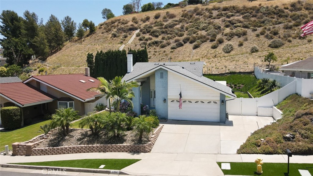 Welcome to 6200 Fairlynn Blvd—where home, lifestyle, and location all come together.
Tucked in the hills of Yorba Linda, this move-in ready 3-bedroom + loft pool home is the kind of space that makes you feel at ease the moment you arrive. From the curb, you’ll notice the pride of ownership—fresh paint, dual-pane windows, and clean lines—but it’s once you step inside that the home truly begins to tell its story.
A light-filled living room with soaring cathedral ceilings welcomes you in, while warm bamboo flooring flows underfoot. The cozy kitchen is designed to gather and connect, featuring granite counters, maple cabinetry, stainless steel appliances, and a professional-grade Jenn-Air 6-burner range. You’ll love the walk-in pantry, under-cab lighting, and the way the kitchen flows seamlessly to the dining and living spaces.
Three bedrooms are conveniently located on the main floor, including a spacious primary suite with en-suite bath and walk-in closet. Upstairs, a loft offers endless versatility—whether it’s a home office, media room, playroom, gym, or a creative mix of all four.
But the real magic happens out back. A covered 300+ sq ft patio features a built-in Viking grill, granite bar, misting system, and remote-controlled canopy—ideal for entertaining on those sunny SoCal afternoons. The saltwater pool is just the beginning. This home sits on a rare 19,832 sq ft lot with untapped potential—build a view deck, a garden, a sports court... whatever your heart desires.
And when you step outside your front door? You're just moments from Yorba Linda’s most loved perks—award-winning Glenknoll Elementary, Bernardo Yorba Middle, and Esperanza High are all nearby. Stroll to scenic equestrian trails, play a round at Black Gold or Yorba Linda Country Club, and explore local gems like Stefano’s, Rooster’s Teahouse, The DIVE, OC Wine Mart, and Bruster’s Ice Cream.
This isn’t just a house—it’s the next chapter of your life. And it’s waiting for you here, in one of California’s safest, most connected, and most beloved communities.