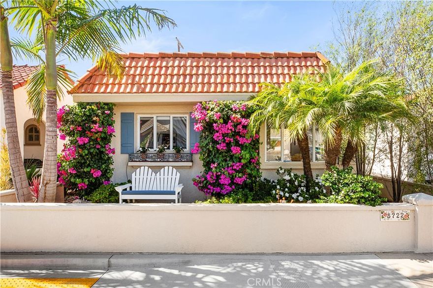Located in the heart of Naples Island, this pristine 2 bed, 2 bath beach house offers the perfect blend of classic character and modern comfort. Originally built in 1949 and thoughtfully remodeled throughout, the home showcases mid-century design elements, including beamed and vaulted ceilings in the living room and a dramatic stacked-stone fireplace. A private courtyard entry opens to a beautiful outdoor entertaining space, seamlessly connected to the light-filled interior through French doors and a wall of windows. The updated kitchen features stainless steel appliances, custom backsplash, quartz countertops, and a charming built-in banquette dining nook. Both bathrooms boast custom tiled showers, and the two spacious bedrooms include a serene primary suite with attached bath. Move-in ready and just steps from the canals, shops, and dining—this is the ideal coastal retreat!