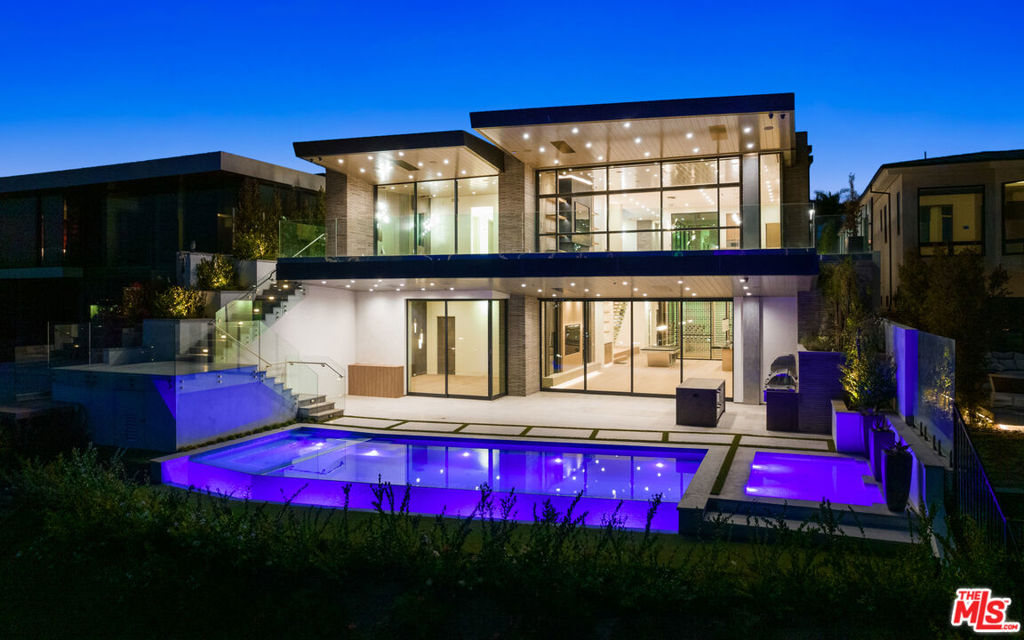 Situated in Irvine Terraces premier front row location, this brand new construction trophy property on Dolphin Terrace overlooks all of Newport Harbor from sunrise to sunset. Boasting almost 8,000sf of luxury living space, this Brandon Architects design is for your most discriminating buyer. This estate was intricately curated with extreme elegance and sophistication: unparalleled architectural scale, soaring 11.5-foot ceilings rising above the white oak wood floors, immaculate 4 bedrooms + office, 8 bathrooms, and multi-use living spaces. State of the art accommodations permeate this property: wellness room and fitness center, private movie theater, 4 car garage, 1,300 bottle temperature controlled glass wine room with biometric lock, full bar, entertainment lounge, elevator and much more! Maximum convenience and comfort embed every facet of this home, every desire controlled by the touch of a button via a sophisticated Savant System. The expansive main level features sophisticated living spaces a state of the art chef's kitchen with Gaggenau appliances, an oversized center island with Quartzite countertops plus dirty kitchen expanding to the dining room and living room with floor to ceiling glass custom Renlita door which vanishes maximizing the Newport Harbor views whilst seamlessly connecting indoor and outdoor space. The grand primary offers an infusion of rich hues and textures boasting a dramatic stone fireplace, floor to ceiling glass and an expansive balcony overlooking the views. The spa-like primary bath and custom walk in wardrobe with leather and suede finishes. The main level is completed with an office, en-suite guest room and laundry room #1. The entertainers lower level houses a private home theatre, wellness room + gym, wine cellar, secondary primary suite, additional en-suite guest room and incredible family room with bar and disappearing walls of glass to extend to your private entertainers backyard with built in BBQ kitchen, zero edge infinity pool all overlooking Newport's finest. This one-of-a-kind property is a must see!