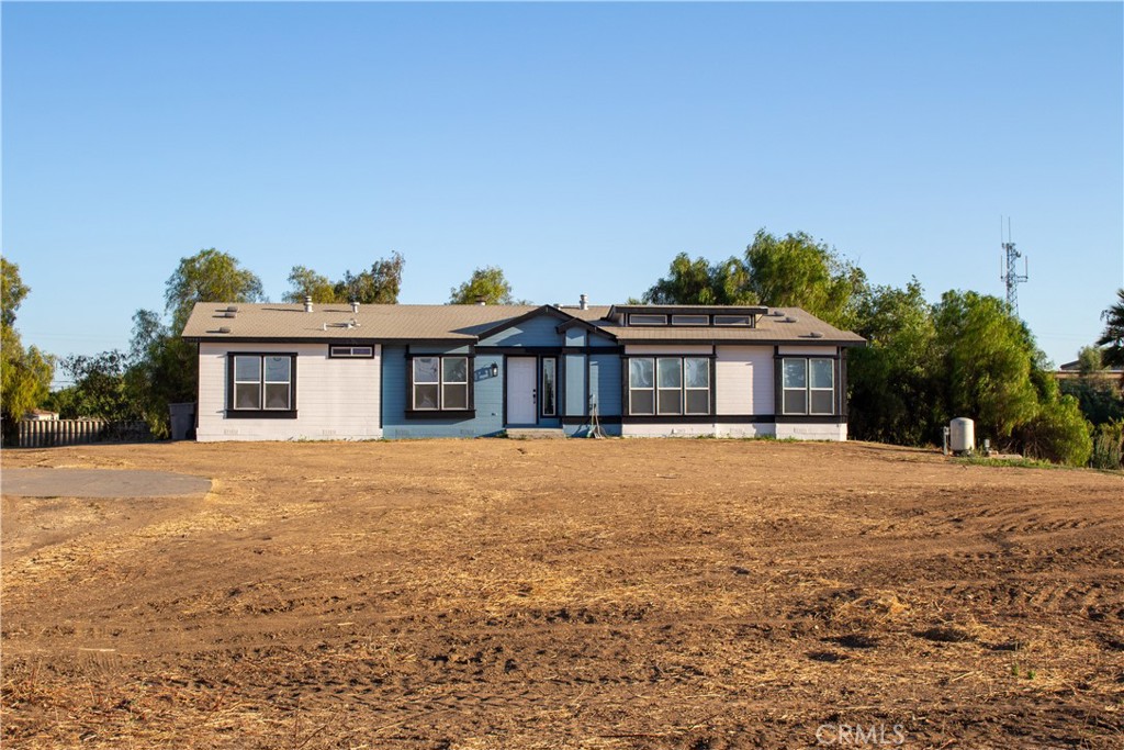 Move-in ready and full of potential, this beautifully updated home sits on 2.3 acres in one of Southern California’s fastest-growing areas—just off the 215 Freeway and a block from the rapidly developing Cajalco Rd. The property features an open floor plan, a fully remodeled kitchen with brand-new appliances, fresh paint, new countertops, cabinets, flooring, and stylish modern finishes throughout. With its own private well and a spacious metal building with two roll-up doors—perfect for a workshop, storage, or commercial use—there’s plenty of space for whatever the buyer desires. Whether you’re looking to run your business from home or enjoy a peaceful rural lifestyle, this property offers the best of both worlds. Located near major freeways, schools, and shopping centers, this is a rare opportunity to own a versatile property in a prime location with outstanding growth potential.