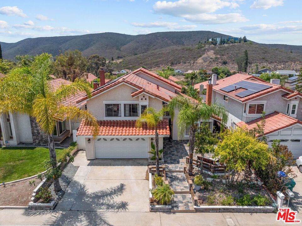 Rare Mediterranean Oasis in Rancho Penasquitos. Escape to this stunning Mediterranean-style home nestled in a highly desirable pocket of Rancho Penasquitos. With breathtaking mountain views, this property offers a tranquil retreat from the hustle and bustle of city life. Key Features: Front Yard -Well manicured trees with luxurious tiled entertainment patio. Spacious Living: 4 bedrooms, 3 bathrooms, and 2,641 square feet of living space - Private Oasis: Swimming pool and jacuzzi perfect for relaxation - Unique Landscaping: Lush tree farm featuring Loquat, Apple, Tangerine, Pomegranate, Lime, Persimmon, Avocado, Plum, and Apricot trees (Add a deck or let your imagination run wild) Expansive Outdoor Space: Built-in clay oven and rare big lot bordering two streets with access from both sides - Energy Efficiency: Solar panels eliminate thousands of dollars in electricity costs - Gourmet Kitchen: Black granite countertops, giant eat-in breakfast counter, seamlessly flows into the family room - Luxurious Amenities: Stacked stone fireplace, wet bar with ice maker and water filtration - Desirable Location:- Award-Winning Blue Ribbon Schools: Part of the prestigious Poway Unified School District, with Rolling Hills Elementary just a short walk away- Accessibility - 15 minutes to the Beach and to Del Mar - Commute: Easy access to the 5 freeway and 56 - Shopping and Fitness: Close proximity to shopping centers, Costco, Trader Joe's, and 24-hour fitness - Maintenance: Newer pool circulation and filtration system, HVAC unit replaced about 4 years ago - Updated: Bathrooms and upstairs LVP flooring... too much to list. Don't miss this rare opportunity to own a unique piece of paradise in Rancho Penasquitos. With its perfect blend of natural beauty, luxurious amenities, and desirable location, this home is sure to attract attention from multiple buyers. This well maintained home exhibits all the qualities you need at a great price. Comparable properties really do not compare to this home at its current price per square foot. Showing access this weekend!