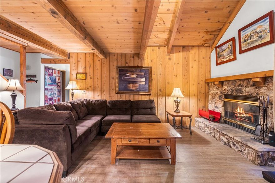 Charming 2-Bedroom Cabin with Summit Ski Resort Views! Welcome to your perfect mountain getaway! This cozy 2-bedroom, 2-bathroom cabin in beautiful Big Bear offers classic alpine charm with modern comfort. Nestled in a peaceful neighborhood, this two-story home boasts spacious carpeted bedrooms upstairs, providing a warm and inviting retreat after a day on the slopes. Downstairs, you’ll find a welcoming living area with durable vinyl flooring, perfect for relaxing or entertaining guests. The open layout flows seamlessly into the kitchen and dining area, making everyday living and hosting a breeze. Step outside to the private patio area, ideal for morning coffee or evening stargazing—with beautiful views of Summit Ski Resort right from your own backyard! Whether you're looking for a weekend escape, a rental investment, or a full-time residence, this cabin has everything you need to enjoy the best of Big Bear living. Just minutes from skiing, hiking trails, the lake, and the village.