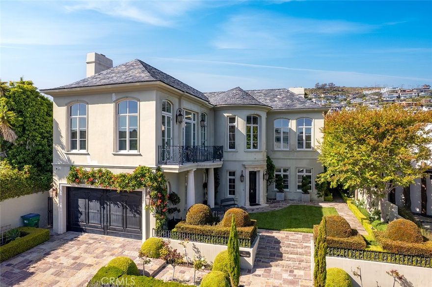 121 Emerald Bay is a rare opportunity to lease a home in the exclusive, guard-gated community of Emerald Bay—now available for the first time as a 12-month lease. Ideally situated on the south side of PCH within the sought-after north end beach enclave, this elegant Colonial-style residence boasts ocean views, refined architectural details, and a spacious, light-filled floor plan.

The home features 5 bedrooms and 4.5 bathrooms, with an ideal layout offering four bedrooms on the main level, including a gracious primary suite with a fireplace and private ambiance. An additional bedroom upstairs offers flexibility for guests, or a home office.

The living room offers an inviting space with beautiful ocean views, while the adjacent patio provides a peaceful setting to enjoy the scenery. A formal dining room connects seamlessly to the chef’s kitchen, which features high-end appliances and generous counter space, ideal for both everyday living and entertaining.

Experience the best of coastal living with exclusive access to Emerald Bay’s exquisite beach, community amenities, and 24/7 gated security—all from the comfort of this timeless seaside home.