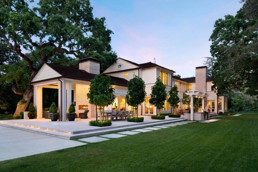 Nestled on one of the most coveted streets in Atherton, this custom-built estate epitomizes refined living with its impeccable design & superior craftsmanship. Upon entry through the contemporary steel & glass doors, guests are greeted by grand living & dining rooms. The chef's kitchen is a culinary masterpiece, featuring top appliances, center island & walk-in pantry. The kitchen seamlessly flows into the inviting great room, where the soaring ceiling, cozy fireplace & stacking doors lead to the outdoor terrace, blurring the lines between indoor & outdoor living. The backyard oasis, complete with pool, spa, outdoor loggia with fireplace, firepit & outdoor kitchen, is surrounded by mature perimeter privacy hedging. The upper level offers a luxurious primary suite with vaulted ceiling, fireplace, private office & spa-inspired bath. Three additional en suite bedrooms & a kids' lounge complete the upper level. The lower level features a 5th bedroom suite with private entrance, rec room & glass-enclosed wine cellar. Additional highlights include an executive office, 3-car garage & gated entry. Experience unparalleled luxury living in this exceptional Atherton estate, where every detail has been thoughtfully curated for the discerning buyer seeking the epitome of California living.