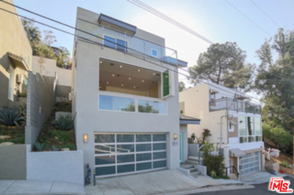 Elegant, charming and well-crafted 2018 Modern masterpiece in the heart of one LA most desired neighborhood-Mt Washington and its highly south Elementary school. This one of a kind three story home is focused on aesthetic simplicity, impeccable quality, and showcases panoramic views. The dramatic entry reveals an impressive open floor plan. High ceilings with abundance of natural light. The centerpiece of the house is a twelve foot open bay window in the living room that reveals the stunning views of snow capped mountains in winter. Open kitchen with black stainless steel appliances, stylish light fixtures and subtle finishes throughout creates the perfect place to entertain and leave away from the chaos, yet still having easy access to Downtown, Pasadena and Highland Park. Gold line Metro station at bottom of hill.
