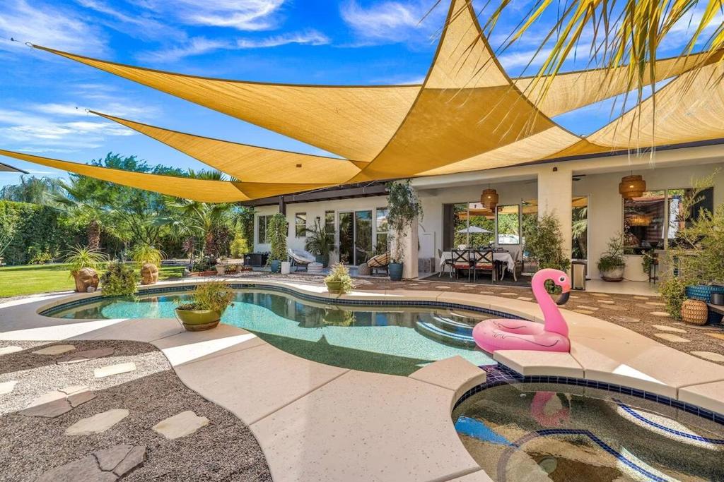 Escape to the perfect seasonal retreat in this stunning 4-bedroom, 3-bathroom home nestled within a secure gated community in Cathedral City, right on the border of Rancho Mirage. This residence offers the ideal blend of relaxation and elegance, designed to meet your every need. The interiors are a masterpiece of artistic design and refined sophistication, where every detail has been carefully curated for ultimate comfort and style. Each of the four bedrooms is its own peaceful sanctuary, complete with plush bedding and private en-suite bathrooms, ensuring a restful and rejuvenating stay.Step outside into your private paradise and be greeted by a spacious backyard oasis. Here, you'll find a saltwater pool and spa, perfect for cooling off or unwinding at the end of the day. The outdoor space also boasts a deluxe barbecue grill island, a dining table for al fresco meals, fire pits for cozy evenings, lounge areas for sun-soaked relaxation, and a luxurious cabana for added shade and comfort. This outdoor oasis is perfect for entertaining, relaxing, or simply enjoying the serene desert surroundings.Whether you're looking for a tranquil retreat to recharge or an adventure-filled getaway, this exceptional property offers the ideal setting for creating unforgettable memories. Don't miss your chance to experience everything this exclusive oasis has to offer!