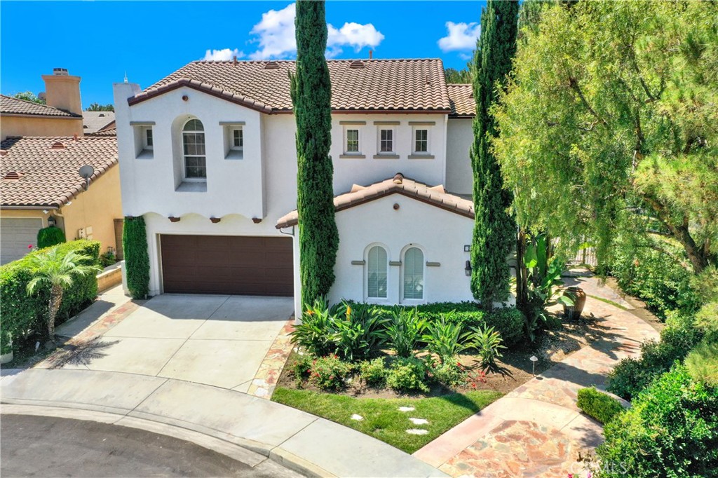 Welcome to this beautifully renovated 4-bedroom, 3-bathroom residence nestled at the end of a quiet cul-de-sac in one of North Irvines most desirable neighborhoods, Northpark Square. Boasting little over 3,500 square feet of expansive living space, this home is on the market for the very first time and blends timeless Santa Barbara charm with modern elegance.
As you approach the home, you’re greeted by a serene front fountain and lush, tropical landscaping that sets a warm, resort-like tone. Step inside to an open and airy floor plan flooded with natural light, featuring brand-new luxury laminate flooring, fresh interior paint, and a completely updated kitchen with sleek new quartz countertops and brand new stainless steel appliances which includes double oven great for your holiday dinners.
The spacious primary suite offers two large walk-in closets, a vanity area, dual sinks, a walk-in shower, and a soaking jetted tub. A secondary upstairs bathroom features dual sinks and a shower over tub. The main-level bedroom has an adjacent full bath with walk-in shower—perfect for guests.
Perfect for entertaining or relaxing, the spacious living areas flow seamlessly to the backyard oasis—complete with mature fruit trees, a tranquil fountain, and plenty of room to dine al fresco or garden in peace. Dual HVAC system that run separately and 3 car attached garage.
Within a short distance to world renowned beaches and shopping which includes Fashion Island and South Coast plaza as well as the many dining options that are located within the Tustin Market place as well as Irvine Spectrum. Don’t miss this rare opportunity to own a turnkey home in a peaceful, private setting—where every detail has been thoughtfully updated for today’s lifestyle.