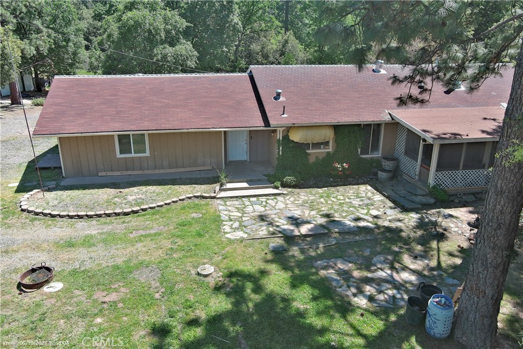 Your peaceful escape in the pines just got even more affordable!
Welcome to your serene woodland retreat, nestled on 6.29 acres of towering pines and natural privacy. With a brand new price of $350,000, this one-of-a-kind property offers incredible value for buyers seeking space, versatility, and quiet mountain living.
More Than Meets the Eye
While county records show 3 bedrooms and 3 bathrooms, this home offers bonus space galore. The converted garage now serves as a massive primary suite with a walk-in closet, attached office, and an unfinished en-suite bathroom ready for your personal finishing touches. (Buyer to verify permits.)
Inside, you’ll find a cozy and character-filled living room with vaulted ceilings, classic wainscoting, and a real wood-burning fireplace—perfect for crisp evenings in the mountains.
Step outside to a fully fenced backyard, covered front porch for morning coffee, and a shady back deck complete with a swamp cooler to keep things cool on summer afternoons.
Converted Master Suite in the remodeled garage has an expansive layout with two rooms and a walk-in closet, the bathroom needs some TLC around the bathtub area and office space
Second Bedroom Includes its own half bath and walk-in closet (perfect for future laundry room)
Third & Fourth Bedrooms are spacious with large closets and lots of natural light
Versatile Outdoor Living & Bonus Structures:
Detached Laundry Room behind the main house
Two Outbuildings – one with checkered flooring, ideal for a workshop, studio, or hobby space
Huge 2,000 sq/ft Metal Shop with roll-up doors and built-in shelving—perfect for equipment, storage, or large projects
Additional Highlights:
Paved driveway with easy access
Fire hose hookup for added safety
Attic storage space
Fully fenced 6-ft yard for pets or play
Propane service
Seller is open to making light bathroom repairs upon request, allowing for a smooth move-in
This property is perfect for anyone dreaming of a mountain homestead, full-time residence, or peaceful getaway. With room to grow, work, or create—plus a significant price drop—this is your chance to make it yours.
Now offered at just $350,000 – don’t miss this opportunity to own a truly unique retreat in the woods! Contact your agent today for a private showing.