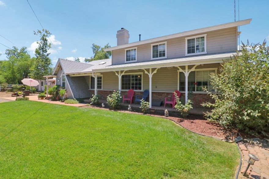 First time on the market in over 20 years! Remodeled in 2001. Quintessential two-story, ranch style home on a HUGE (just under an acre) lot. This house simply "feels like home." As you pull onto the lot, you're greeted by a large round about and ample parking. Inside, you walk right into the family room and see through the open concept into the modern kitchen (feat a propane range oven/stove, and upgraded appliances, like a Bosch dishwasher). The living area includes exposed beams, hardwood flooring, and a wood burning fireplace. Three of the bedrooms, including the primary, are downstairs. Upstairs, you'll find a second living area, an office/optional 4th bedroom, and another large bonus area/playroom. Back outside is a spacious lot, with a koi pond, green grass & beautiful trees, play space, and 4 additional sheds/structures. 2 car garage with side by side electric washer & dryer hookups.