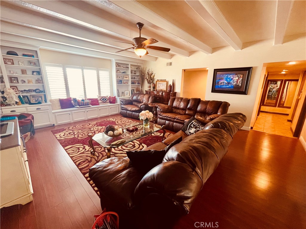Discover this beautifully upgraded single-story pool home in the foothills of North San Bernardino, where comfort meets luxury. Featuring a fully remodeled kitchen and bathrooms with high-end finishes, this home offers a spacious living area with wood laminate and tile flooring, plus cozy carpeted bedrooms. The sparkling pool was refinished just two years ago and is complemented by a versatile pool house—perfect for guests or a home office. Wrought iron fencing adds privacy and curb appeal, while the two-car garage provides convenience and storage. With quality upgrades throughout and a serene mountain view setting, this home is a true gem ready to be enjoyed.